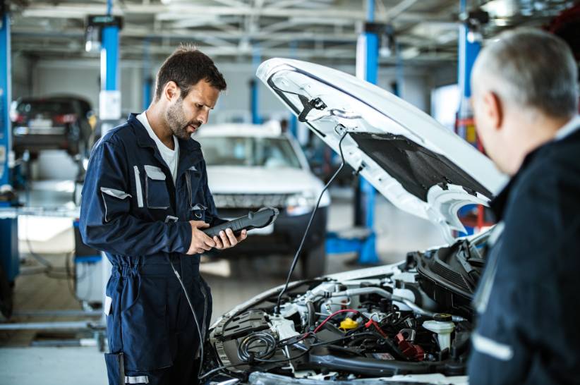 Mechanic taking a look at a car